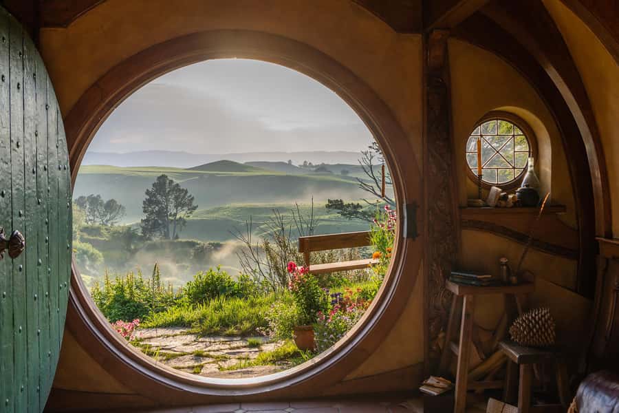 Auckland: Hobbiton & Waitomo Caves Small-Group Tour & Lunch - Hobbiton Movie Set: beautiful, detailed, and busy