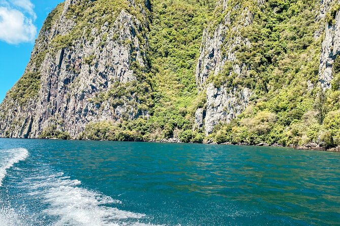 Chasing Waterfalls The Adventurer from Kinloch Marina - Tutaewaeroa waterfall at Waihora Bay