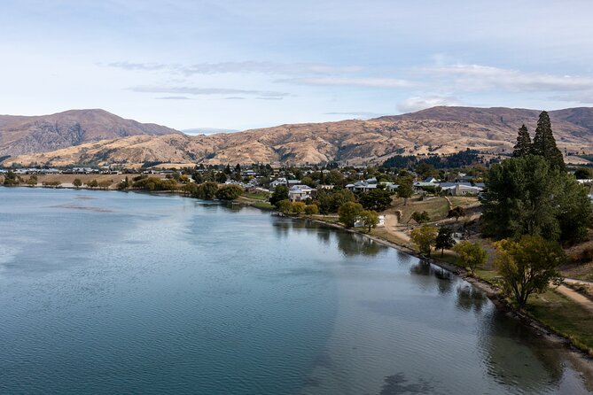 Dunedin to Queenstown One Way Tour Including Taieri Gorge Train - Changing trains for a Central Otago road trip at Pukerangi