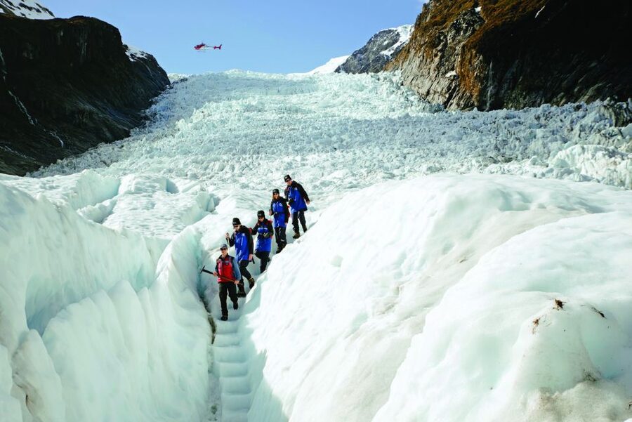Fox Glacier: Up to 3 Hours Hike with Helicopter Transfer - Flying back over the ice