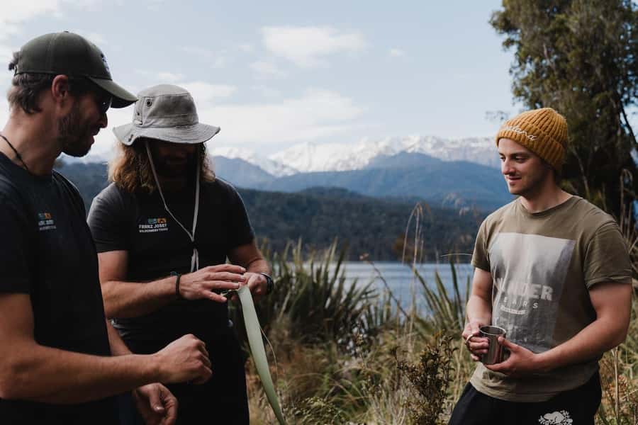 Franz Josef: Kayak & Walking Tour to Okarito Kiwi Sanctuary - Paddling across the still water