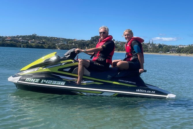 Jet Ski Hire Auckland - Experience the Fun with the Best Operator - Pulling a sea biscuit behind the jet ski