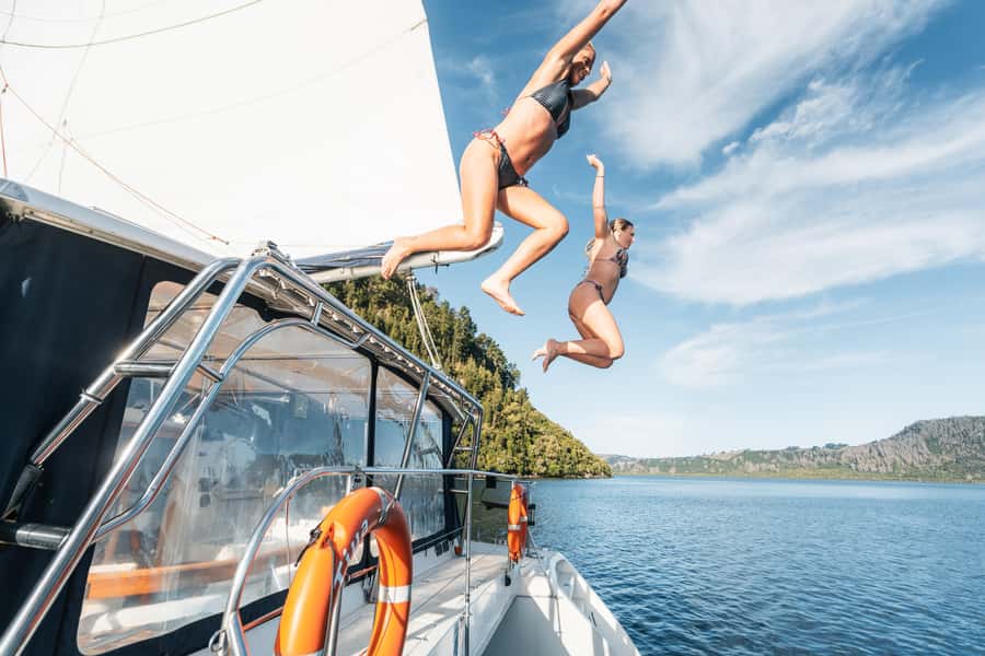 Lake Taupo: Luxury Sailing Catamaran to Māori Rock Carvings - Swimming in the clear, cold lake