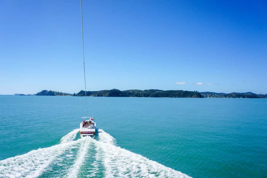 Paihia: Bay of Islands Parasailing Flight - The slow lift from the boat