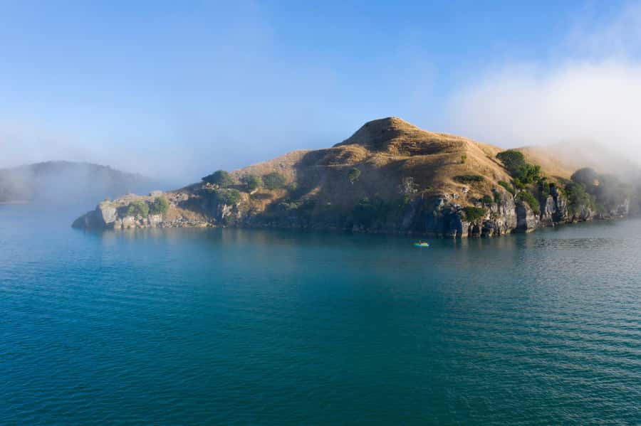 Raglan: Scenic Harbour Sunset Cruise - Ancient pancake rocks and volcanic remains