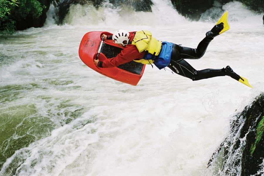 Rotorua Sledging: Kaituna White Water River Board Experience - Native bush and Māori stories along the river