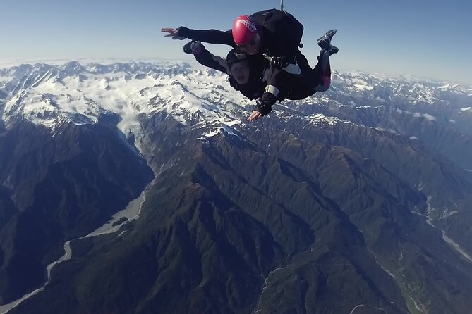 Tandem Skydive 18,000ft from Franz Josef - The flight above glaciers, rivers, and the Tasman Sea
