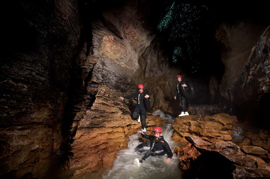 Waitomo Caves Black Abyss Ultimate Caving Experience - Cold water, comfort, and the finish at Long Black Café